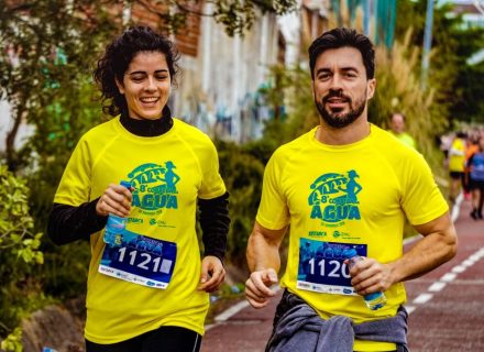 Two athletes participating in a marathon, showing determination and joy.