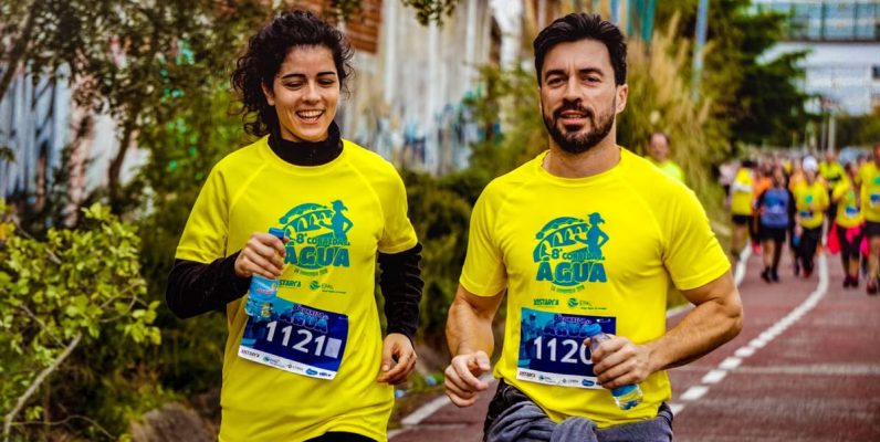 Two athletes participating in a marathon, showing determination and joy.